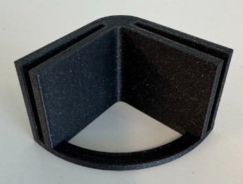 Black 3D-printed slotted 90-degree corner bracket