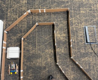 Overhead view of the cardboard test maze with the robot inside